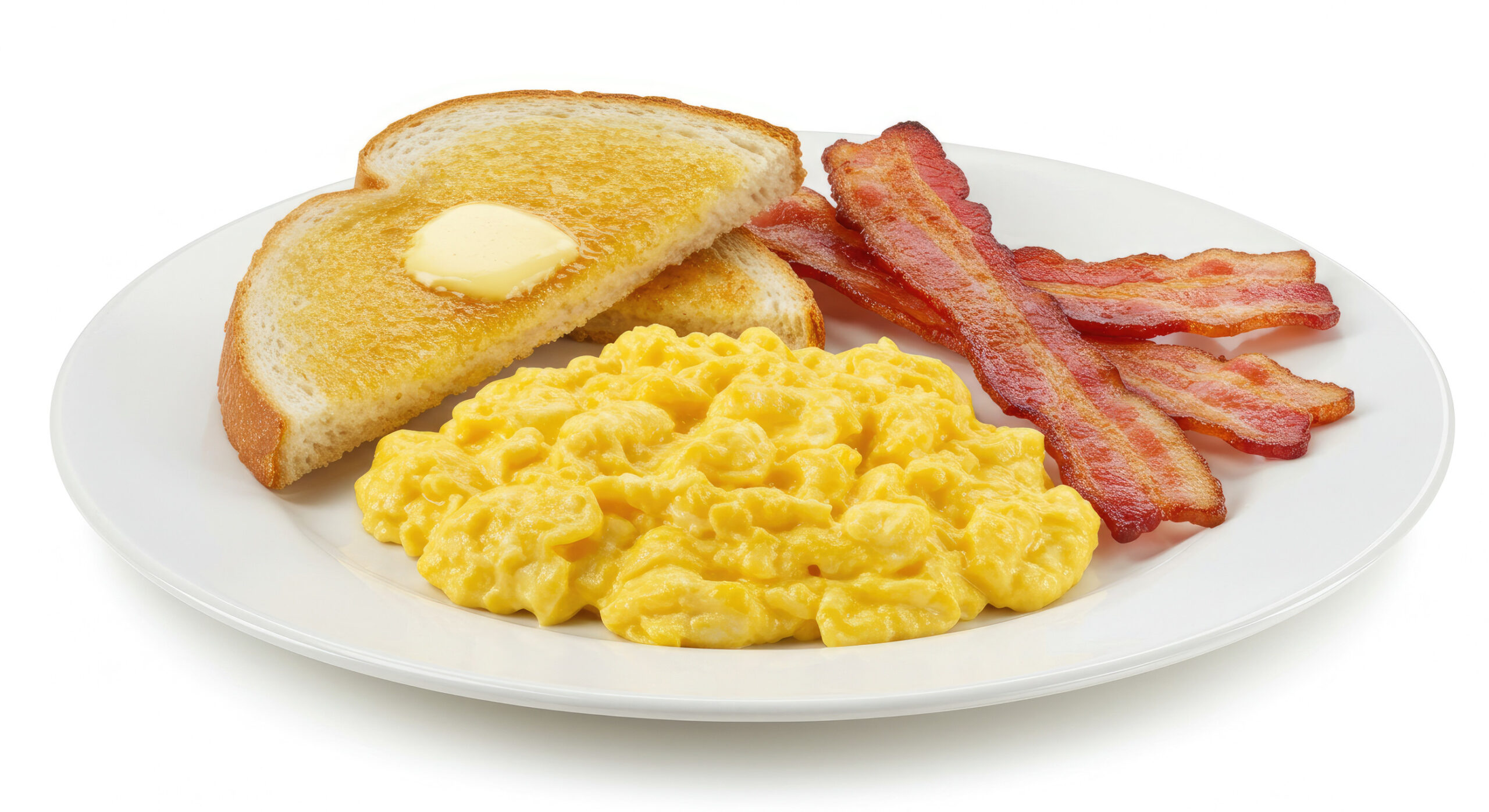 Scrambled eggs with bacon and toast isolated on white background.